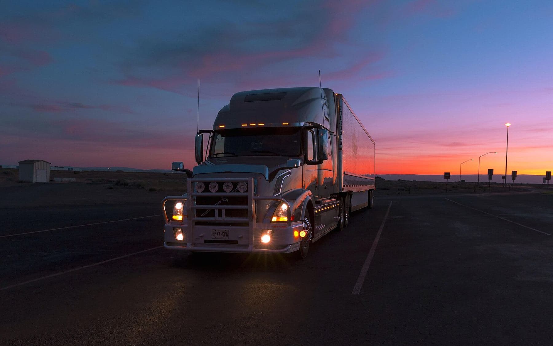Semi truck at dusk on the highway